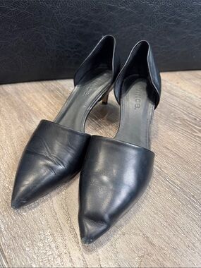 Vince D'Orsay pumps featuring a pointed toe and a kitten heel